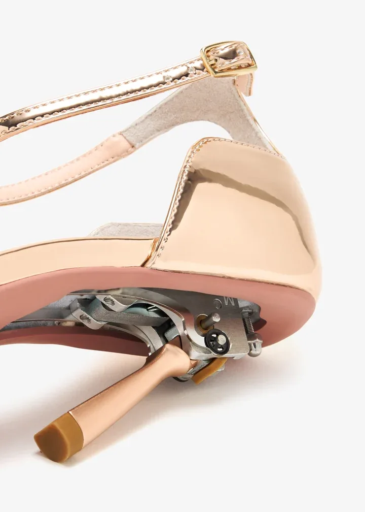 rose gold, metallic sandals with a convertible or retractable heel mechanism